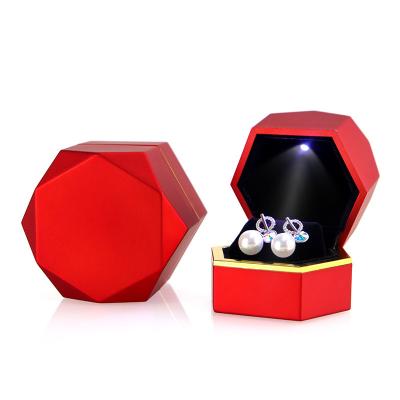 China Fashionable wholesale custom creative design silicone painting hexagon velvet jewelry box with led light for sale