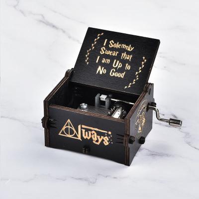 China Custom Gifts Harry New Arrival Potter Mini Hand Crank Laser Engraved Wooden Hand Crank Music Box for sale