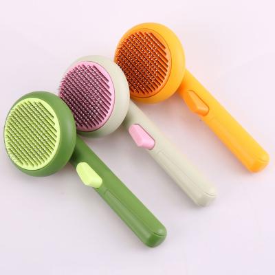 China Viable Wholesale GP036 Dog And Cat One Key Remove Hair Comb Pet Massage Shedding Grooming Comb for sale