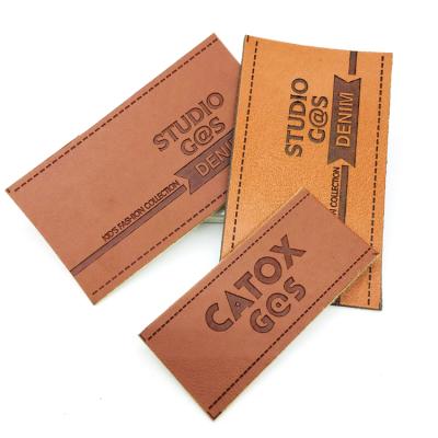 China Viable Custom Name Logo Debossed PU Leather Patches And Labels For Shoes And Bags for sale