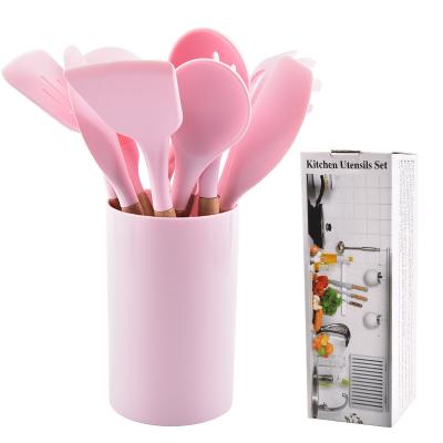 China Stocked Reusable Adaptive Silicone Cooking Skimmer Stainless Steel Wooden Tools Lace 12 Pcs Silicone Kitchen Utensil Set for sale