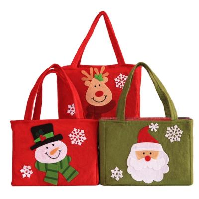 China 2023 Decorative Christmas Day Factory Sale Directly Custom Design Durable Wool Felt Fabric Christmas Candy Santa Claus / Elf Bag / Snowmen for sale