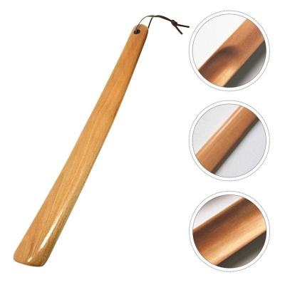 China Eco-Friendly Reducing Bending Over Pain Relief For Seniors Foot Care 38cm Long Wooden Shoehorn Shoe Lifter Handle Wooden Shoehorn for sale