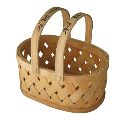 China Tender viable large wooden handmade woven wicker basket storage basket in gifts and crafts wholesales with wood handle for sale