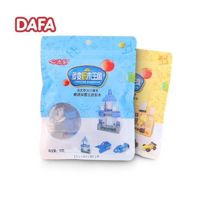 China Promotional Toys Designer Bag Surprise Block Brick Toy Candy Toys for sale