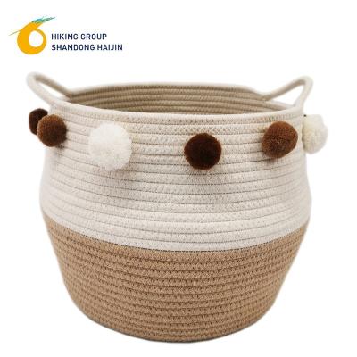 China Latest Design Sustainable Hot Cotton Belly Rope Woven Storage Baskets Brown&white Pom Pom for sale