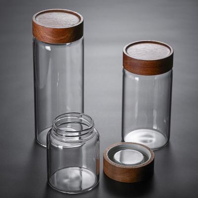 China Sustainable Food Glass Jar Storage Japanese Style Glass Bottle With Acacia Wood Lid for sale