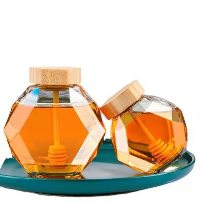 China Borosilicate Glass Heatable Jar With Bamboo Lid Empty Hexagon Honey Jar for sale