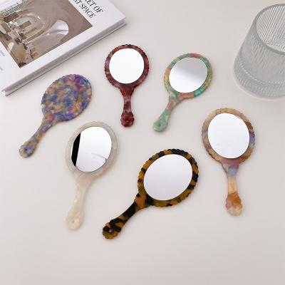 China Retro ECO Acetate Small Leaf Mirror Oval Portable Daily Makeup Mirror Lighted Hand Mirror for sale