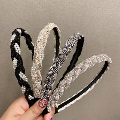 China 2022 New Style Diamond Braid Twist Braid Headband European and American Skull Headband Top Fold Pearl Press Female Headband for sale