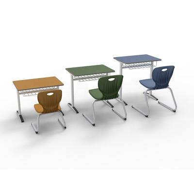 China Simple Modern School Furniture Children's Seater Student Desk Elementary School Table And Chairs Set for sale