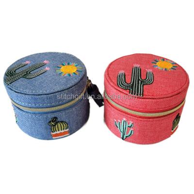 China Fashion Round Zipper Jewelry Case With Tassel Mini Jewelry Pouch for sale