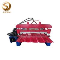 China hoja de acero galvanizada trapezoidal automática estándar euro del panel del tejado que hace la máquina en venta