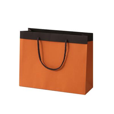 China Premium Recycled Paper Materials Clothing Store Clothing Shoes Shopping Bag Packaging Boxes Tote Bags Gift Bags for sale