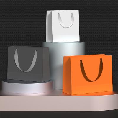 China Recyclable Modern Paper Handbag Gift Bag Paper Handbag Packaging Special Design Paper Bags With Your Own Logo for sale