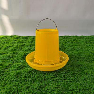 China Yellow Round Plastic Poultry Ration Feeding Bucket 5 Gallon for sale