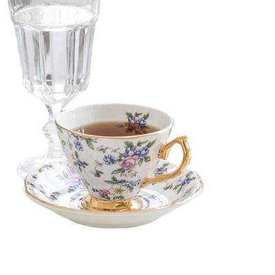 China Dakar Elegant Floral European Home Premium Tea Set Stocked Ceramic Cup Holder And Saucer With Gold Handle for sale