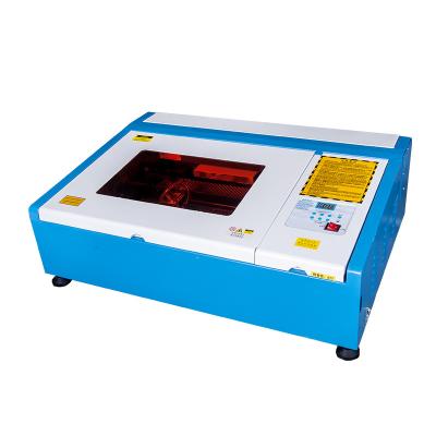 China Water Cooled Used Laser Cutting Machine For Sale 1500w CNC Laser Engraving Machine CO2 Laser Cutting Machine 3020 for sale