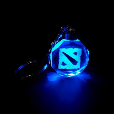 China Custom 3d game souvenir laser engraving dota2 LED logo crystal key chain for game souvenir for sale