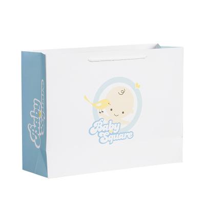 Cina Custom logo baby cloth white art paper bag with handle with your logo in vendita