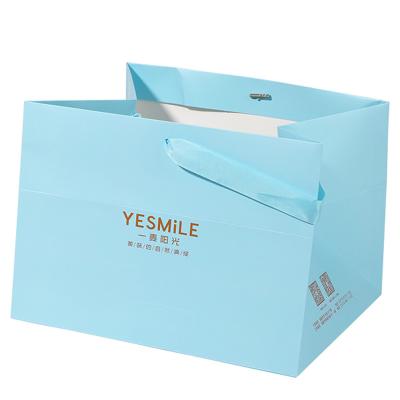 China Hot Sale Blue Big Large Size Paper Tote Shopping Bag in Bulk with Logo Printed for Clothes Shoes Jeans à venda