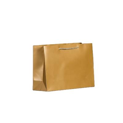 中国 Customized Packaging Paper Bags Printed Logo with Ribbon Handle for Clothes 販売のため