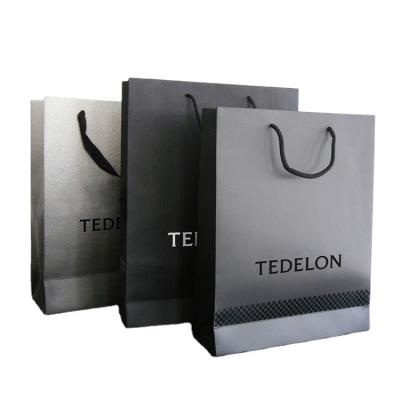 中国 Cheap Custom Printed Luxury Retail Paper Shopping Bag,Low Cost Paper Bag,Color Paper Bag Supplier 販売のため