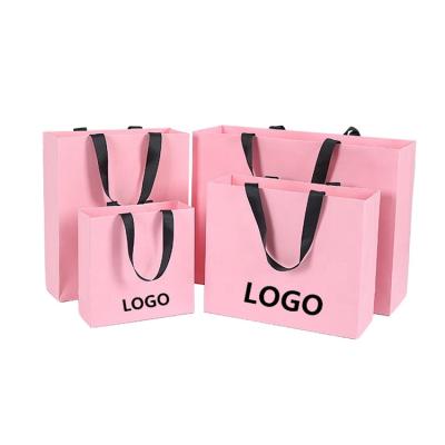 中国 Wholesale New Design Custom Logo Printing Shopping Brown Kraft Paper Bag With Handle 販売のため