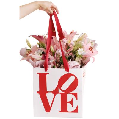 China Transparent Portable Bouquet Carry Bag Cardboard Flower Handbags And Flower Waterproof Membrane Square for sale