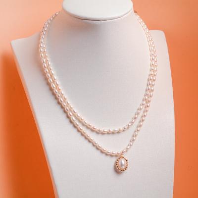 China CLASSIC Natural Freshwater Double Layer Pearl Sweater Chain Necklace Jewelry 14K Gold Plated Handmade Pearl Beaded Necklace For Women for sale