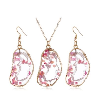 China Hollow Pink Crystal Necklace Earrings Jewelry Set Girl's Necklace Sweater Chain Set Hot Pink Transparent Amber Fashionable Pendant for sale