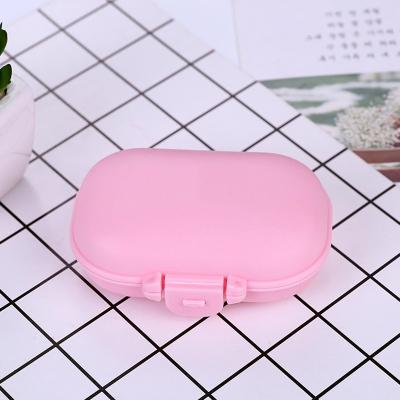 China Food Grade Mini Pocket Travel Portable 4 Compartment Pill Box Pill Box Pastillero Moisture Proof Plastic Case for sale