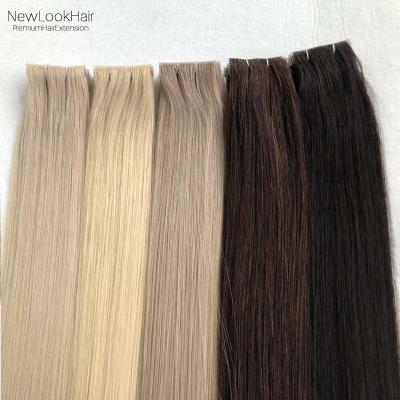 China Silky Straight Wave Good Quality Remy Hair 2.5g Per Piece Hand Tied Invisible Skin Weft Tape In Hair Extensions for sale