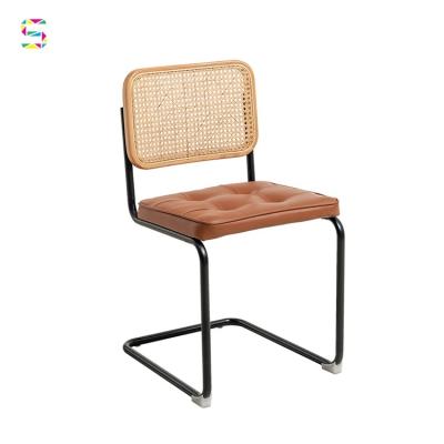 China UNDETERMINED Modern Living Room Rattan Wingback Chair Cushion Dining Chair Rattan Upholstery Chair Metal Leg for sale