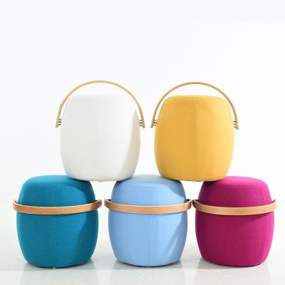 China Modern Wholesale Nordic Bed Stool Round Fabric Stool Bedroom Stool With Handle for sale