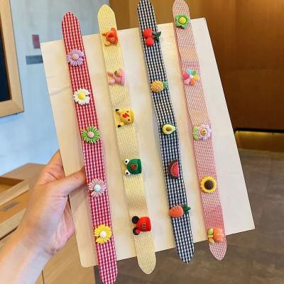 China Fashion hot selling children flower headband cute children's cartoons sticker headbands girl baby magic stickers headdress for sale