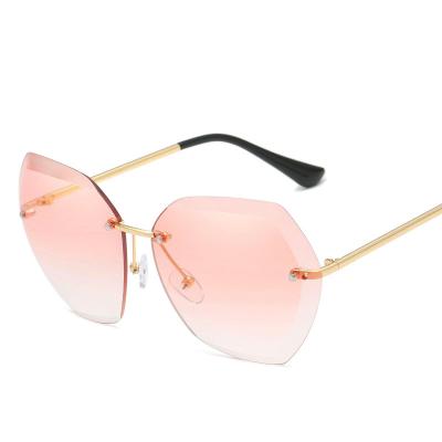 China Fashion sunglasses 2020 round frameless sunglasses metal color ocean glass sun glasses oversized women shades UV400 for sale