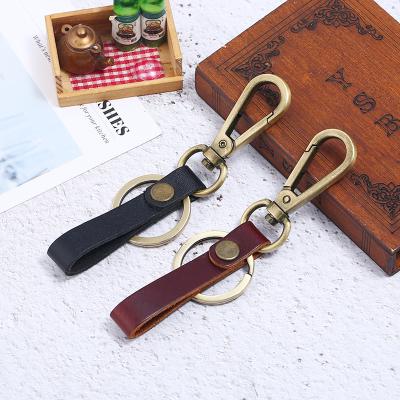 China Retro Leather Key Flag Personalized Snap Hook Bracelet Key Chain Custom Logo Whip Key Chain Bronze for sale