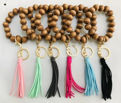 China Personalized Wooden Beaded Key Chain 2021 Keychain Bangle Bracelet Women Men Handmade Leather Wrist Wooden Elastic Tassel Wood Beads for sale