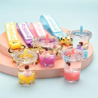 China Wholesale Cute Little Princess Milk Tea Cup Bottle Acrylic Quicksand Cute Floating Pendant Keychain for sale