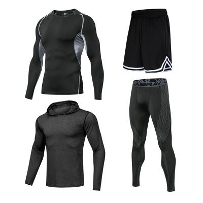 China Men's OEM/ODM 4 Pieces Breathable Sportswear Set Men's Short Sleeve T-shirt Sports Shorts Running Training Elastic Tights Tops Coat Compression for sale