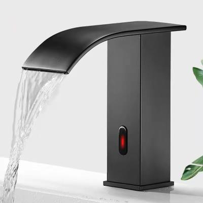 China New Arrival Bathroom Faucets Black Waterfall Automatic Faucet Cold Water Metered Single Sink Taps Sensor Faucet for sale