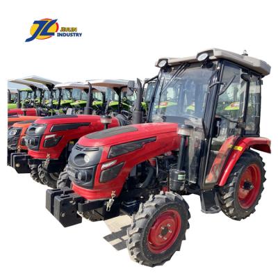 China Construction material shops W mini 4x4 24HP 25HP 30HP 35HP 50HP compact tractors tractors with loader and backhoe made in China by Jiulin for sale