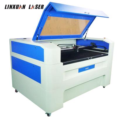 China Automatic Laser CUT 6090 Position CNC CO2 Laser Cutting Machine with CCD Camera for Fabric Cloth Label Cutting for sale