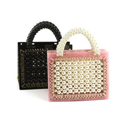 China Korean version fashion high quality bead woven crochet handmade women handbag with acrylic resin frame gilr ladies lining handbag for sale