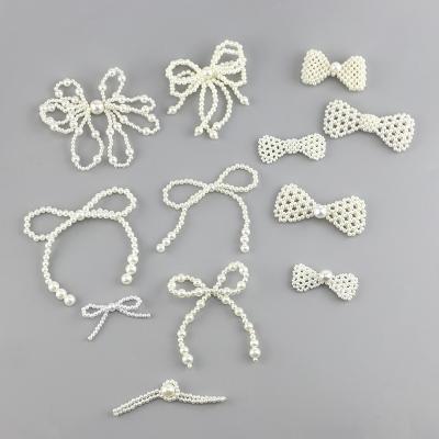 China Handmade White Bow Knot Pearl Pearl Bow Button Accessories for Garment Clothing Hair Shoes and DIY Craft for sale