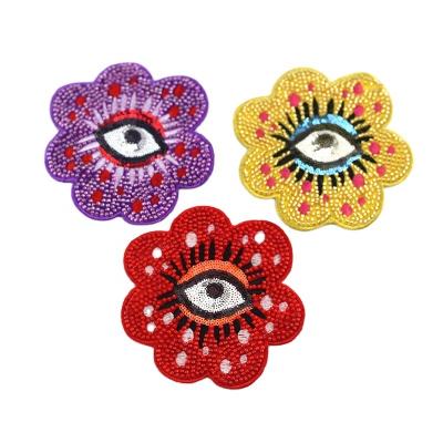 China 3D flower and unique eyes design pattern sequin embroidery sew on patches with glass bead sew on garment accessories for sale