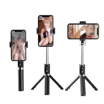 China 360 Degree Portable Flexible Wireless Remote Control Rotating Selfie Portable Mini Foldable Tripod Portable Mobile Selfie Stick Fill Light for sale