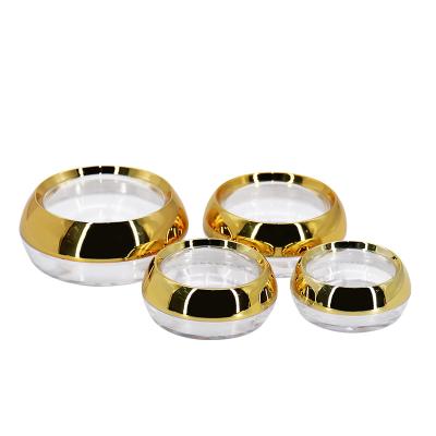 China 10g 20g 50g Cosmetic Clear Plastic Jar Capsule Cream Container With Gold Lid for sale