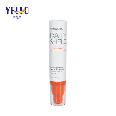 China Skin Care Beauty Packaging Empty Plastic Orange Airless Pump Tube For Essence for sale